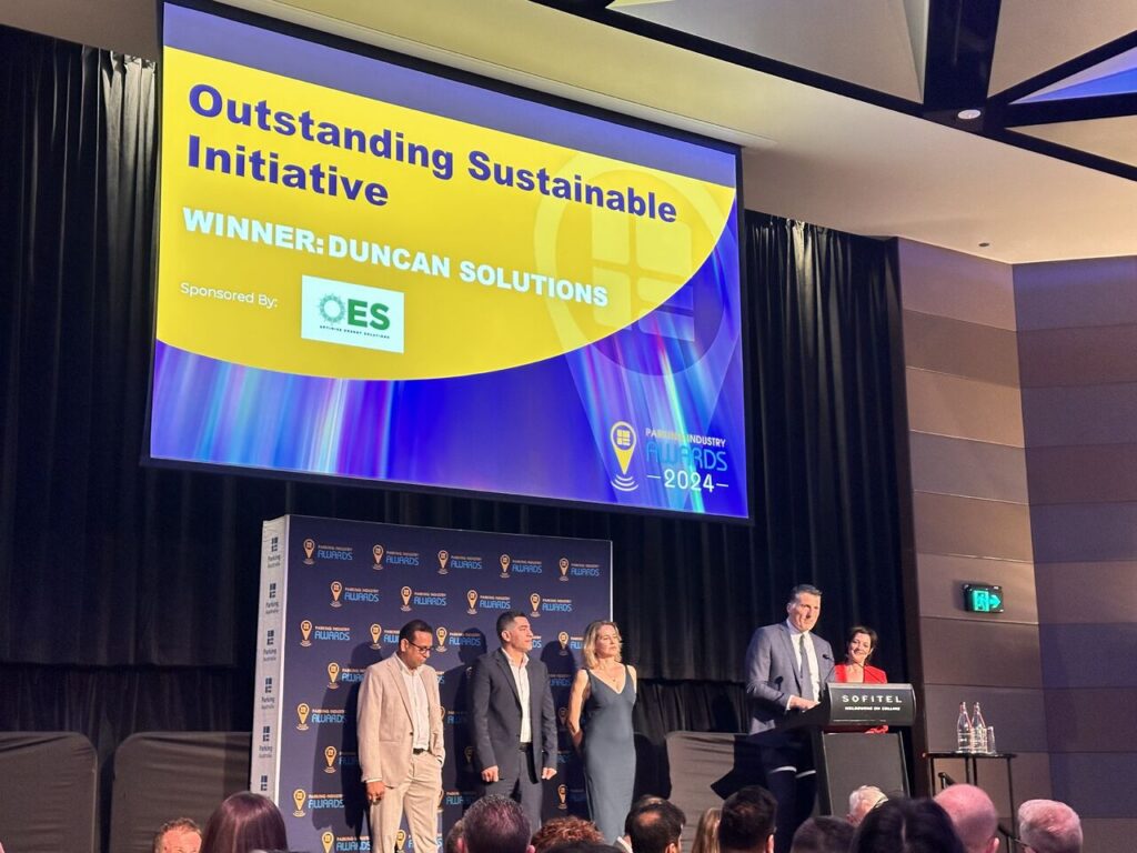 Duncan Solutions team on stage accepting the Outstanding Sustainable Initiative award at the Parking Australia Industry Awards 2024