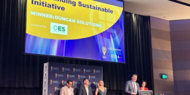 Duncan Solutions team on stage accepting the Outstanding Sustainable Initiative award at the Parking Australia Industry Awards 2024